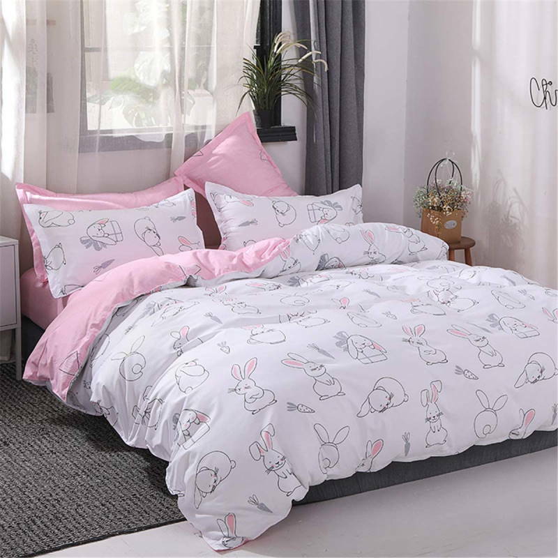 Ropa de cama rosa y blanco con conejos